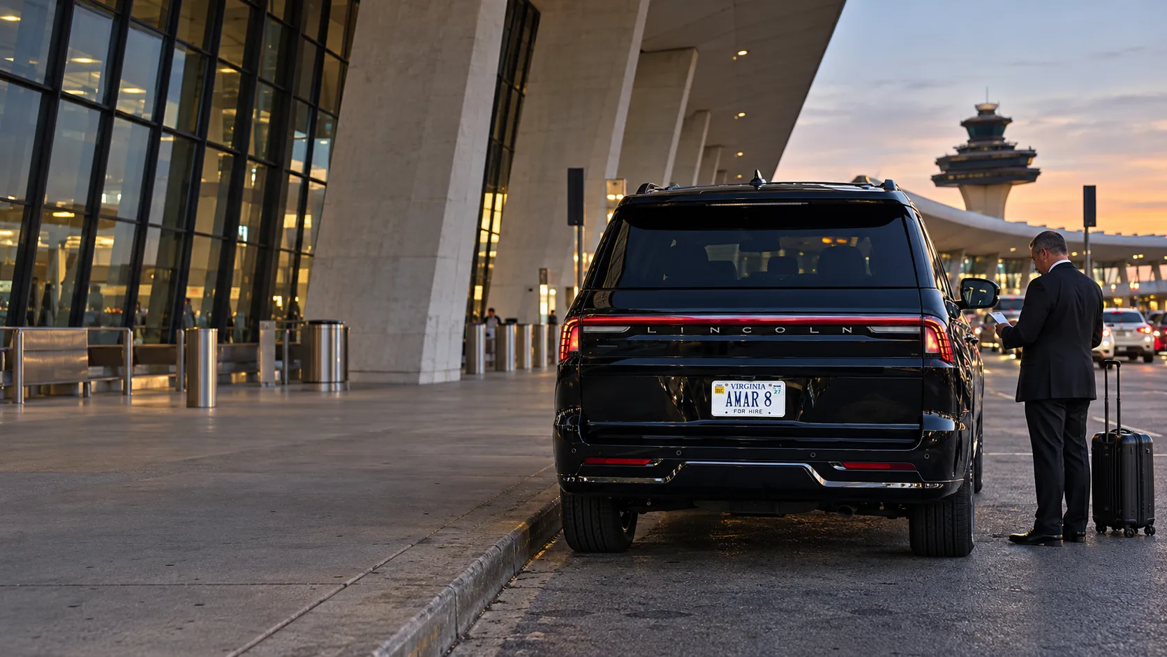 Distinct rear view of a Lincoln Navigator L and chauffeur with airport luggage