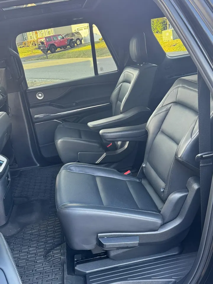 Original Lincoln Navigator second-row black leather captain chairs