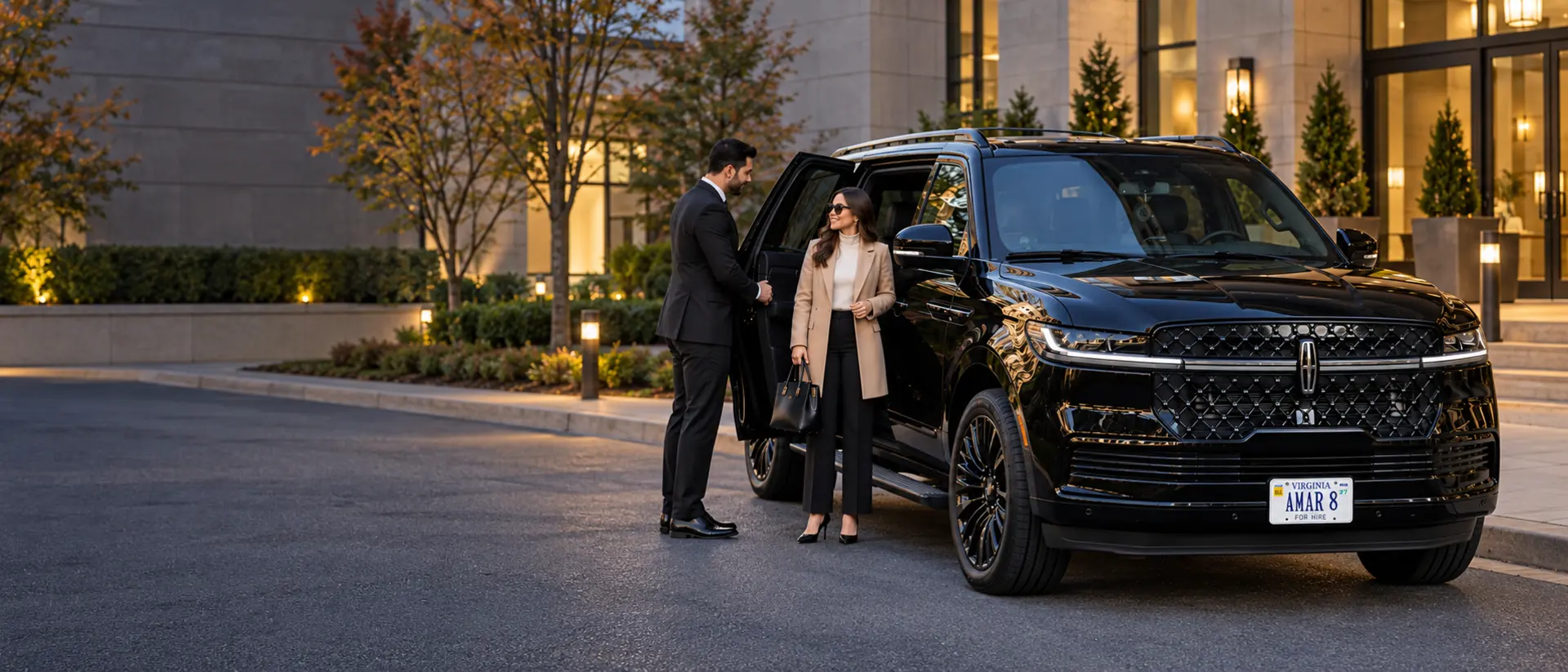 Original-reference AMAR 8 Lincoln Navigator and consistent chauffeur assisting a traveler at an Arlington office