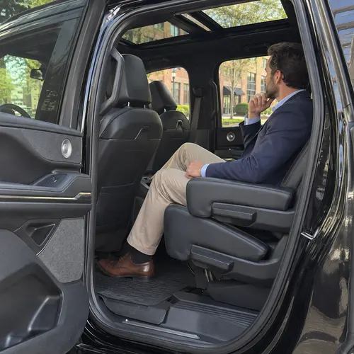 Passenger seated in the original-style black cabin before an appointment
